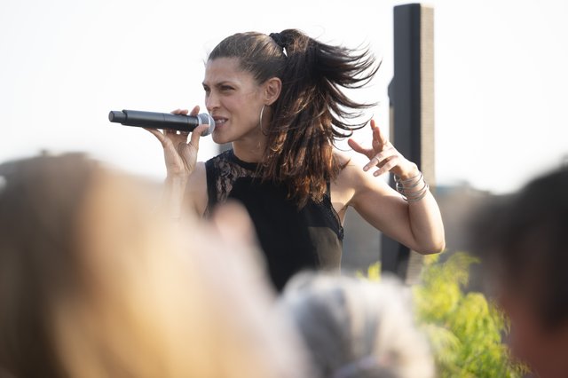 Dessa performing on Hewing Hotel's rooftop