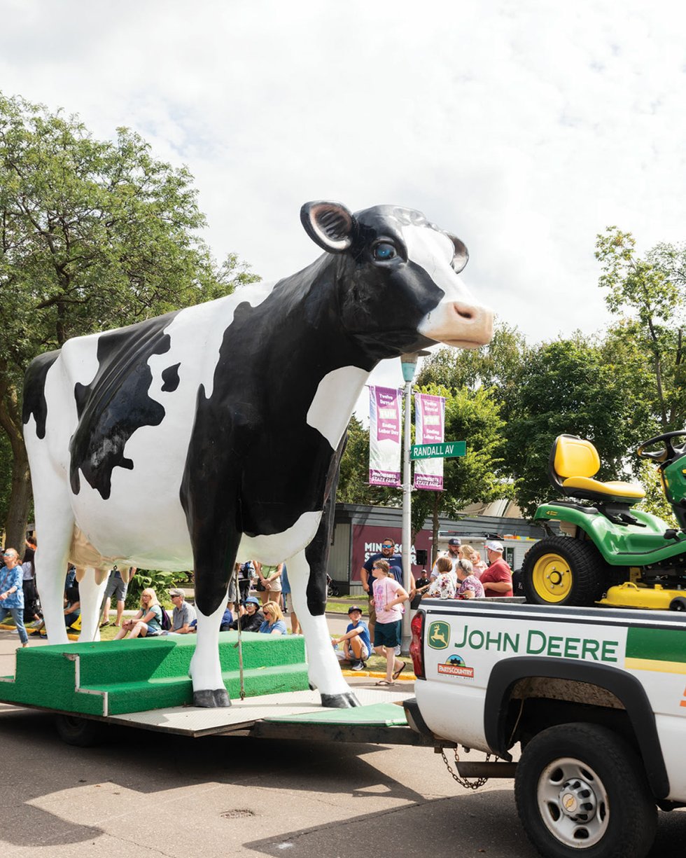 large fiberglass cow in a parade