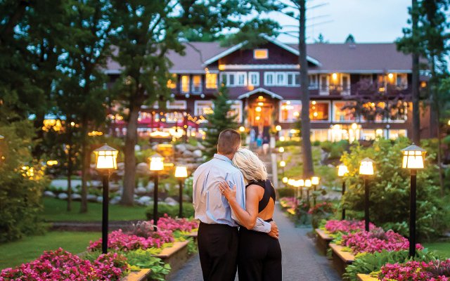 Couple looking at the front of Grand View Lodge